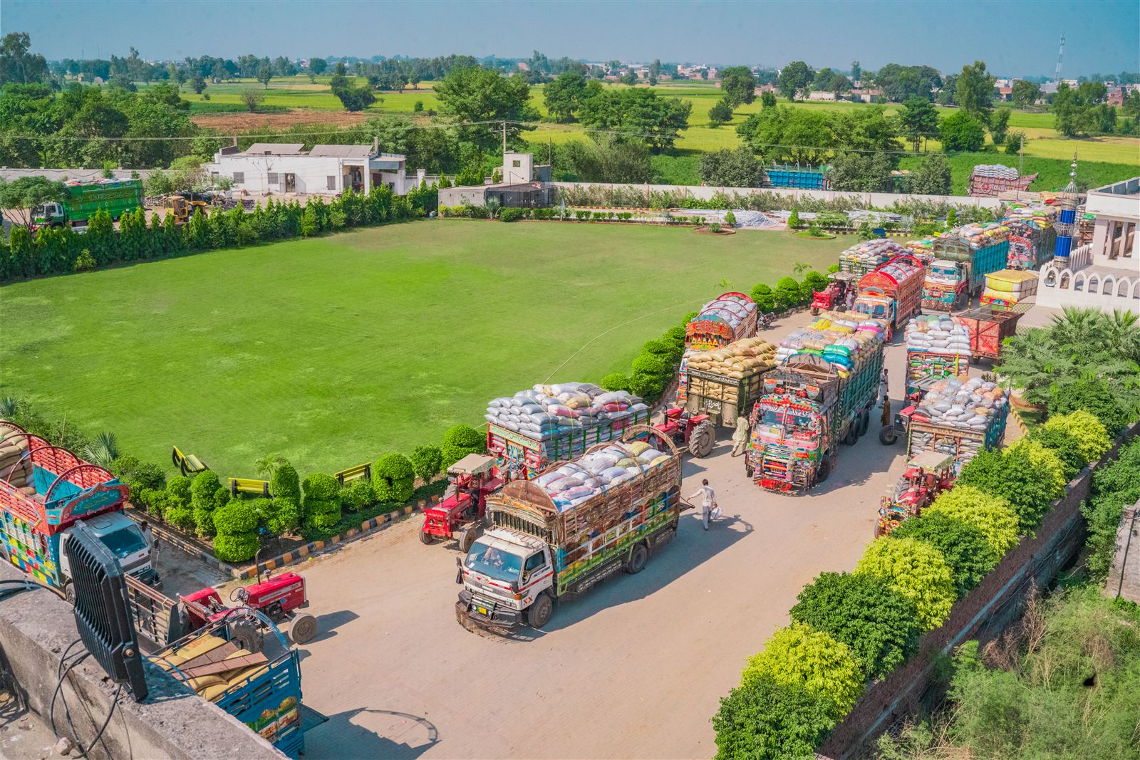 Loaded delivery trucks lined up at the Rachna Foods plant